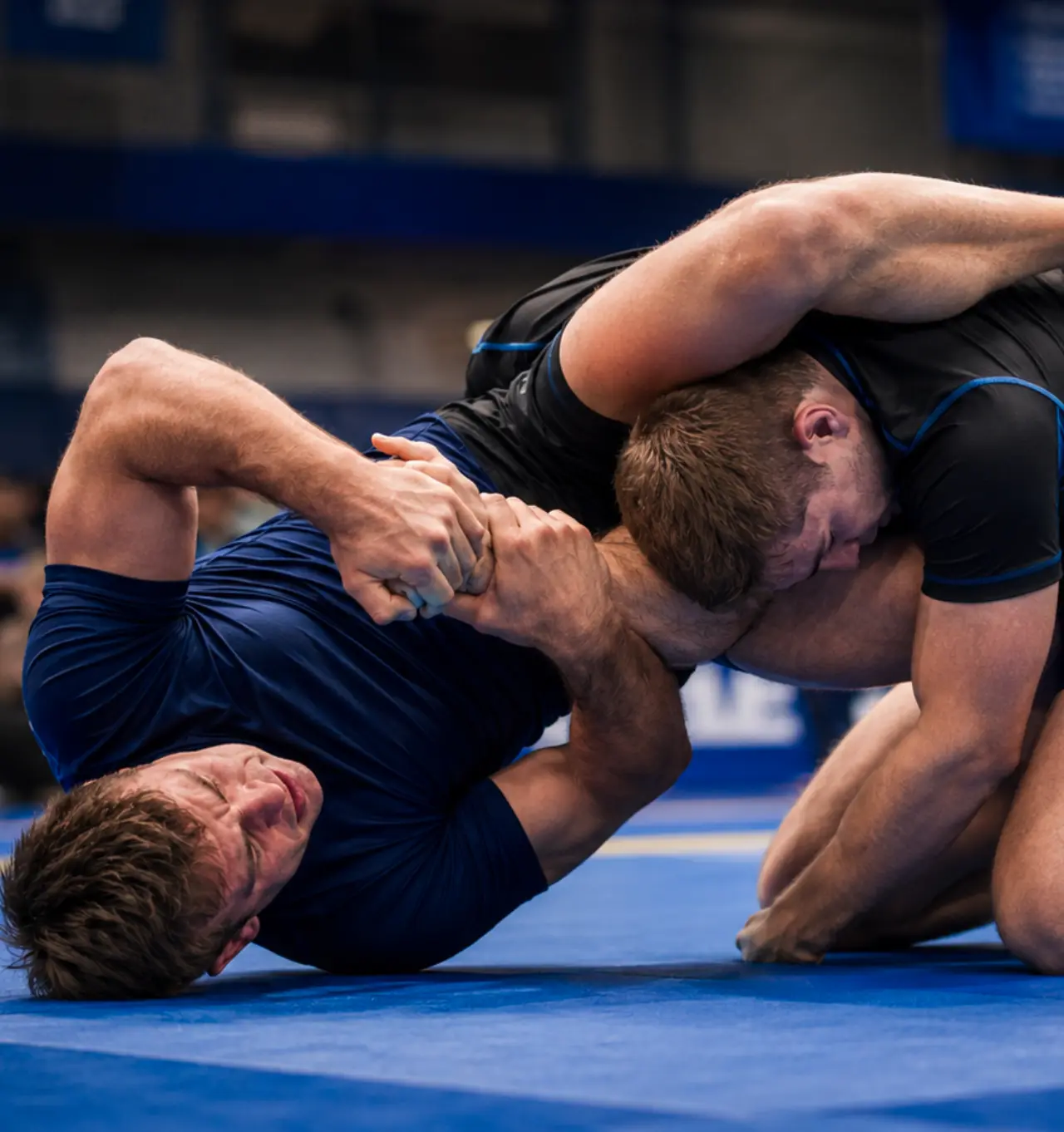 Two grapplers competing on the mat